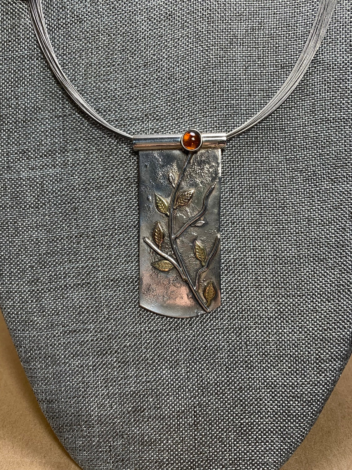 Sterling Silver w/ Garnet and Brass Pendant On Braided Steel Wire